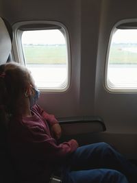 Woman sitting in bus