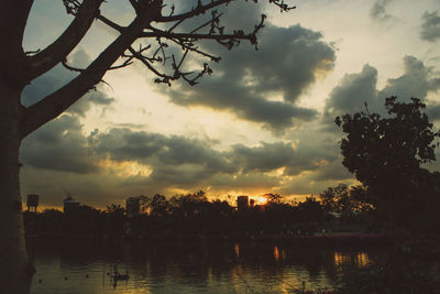 Scenic view of lake against sky during sunset