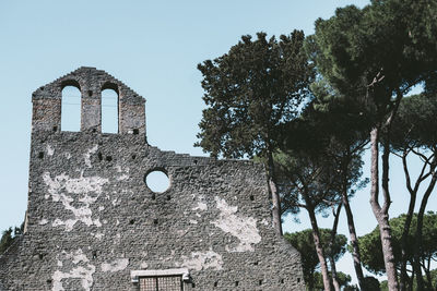 Low angle view of old building against clear sky