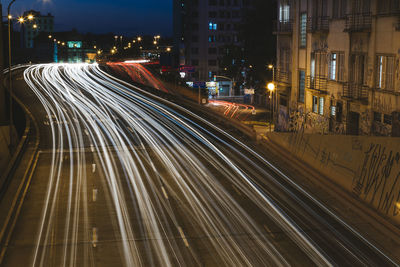 Urban scene with car trails in a viaduct.