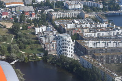 High angle view of river amidst buildings in city