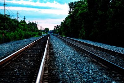 Surface level of railroad tracks against sky