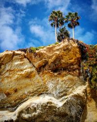 Low angle view of rock formation against sky