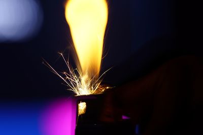 Close-up of illuminated lighting equipment at night