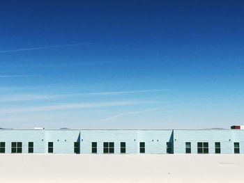 Scenic view of a building against clear blue sky