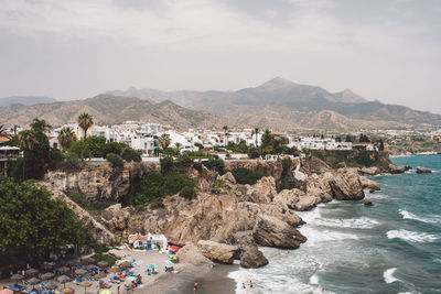 Panoramic view of sea and buildings against sky