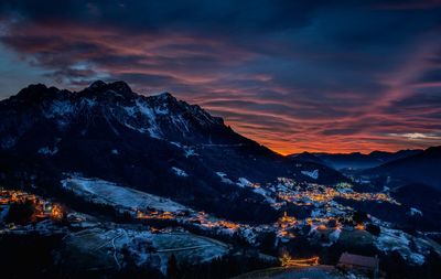 Scenic view of snowcapped mountains against sky during sunset