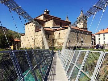 Empty bridge towards old church