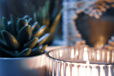 Close-up of illuminated tea light on table