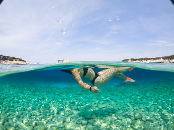 Woman floating - proizd island