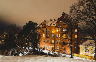 Buildings in city at night