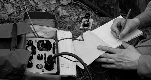 Cropped image of man working on table