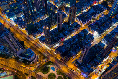 High angle view of city lit up at night