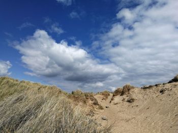 Panoramic view of arid landscape against sky