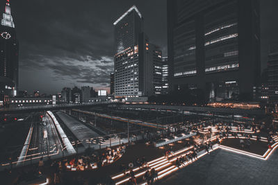 High angle view of illuminated buildings in city at night