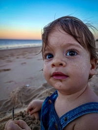 Close-up of a kid at sunset