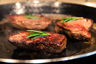 Close-up of meat in plate on table