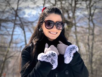 Portrait of a smiling young woman during winter