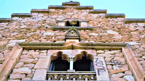 Low angle view of old building against sky