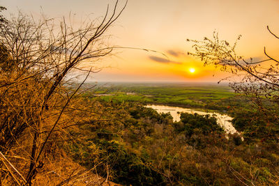 Scenic view of landscape against sky during sunset