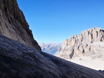 Scenic view of snowcapped mountains against clear blue sky