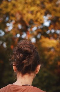 Rear view of woman with hair bun outdoors