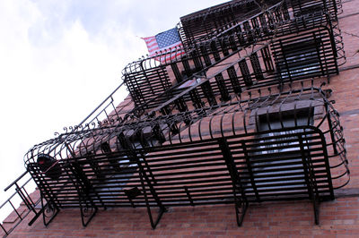 Low angle view of staircase in building against sky