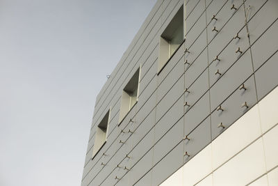 Modern building is gray in color. facing panel on office building. architecture details.