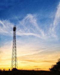 Low angle view of silhouette tower against sky during sunset