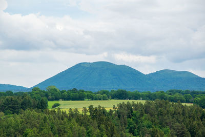 View of the chain of auvergne volcanoes under a thunderstorm