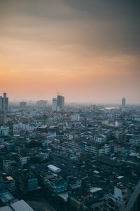 High angle view of buildings against sky during sunset
