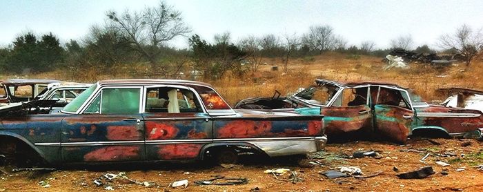 Abandoned car on road