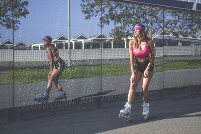 Full length of woman rollerskating