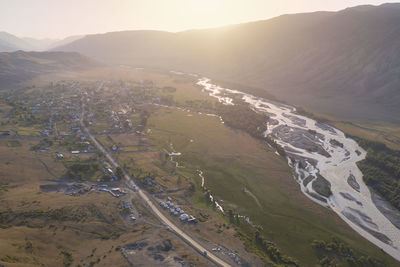 High angle view of land and mountains against sky