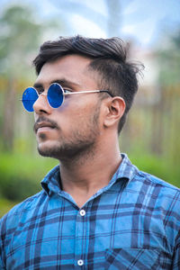 Portrait of young man wearing sunglasses