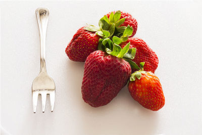 Close-up of strawberries against white background