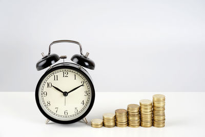 Close-up of clock tower against white background