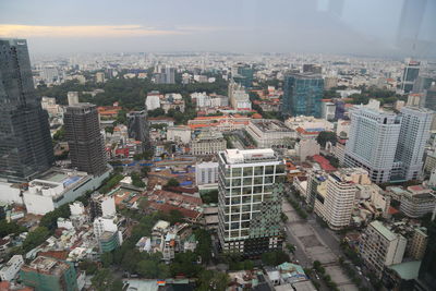 High angle view of buildings in city against sky