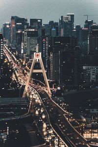 High angle view of illuminated cityscape against sky