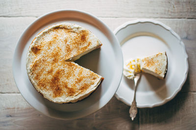 Directly above of cake with cinnamon in plate on table