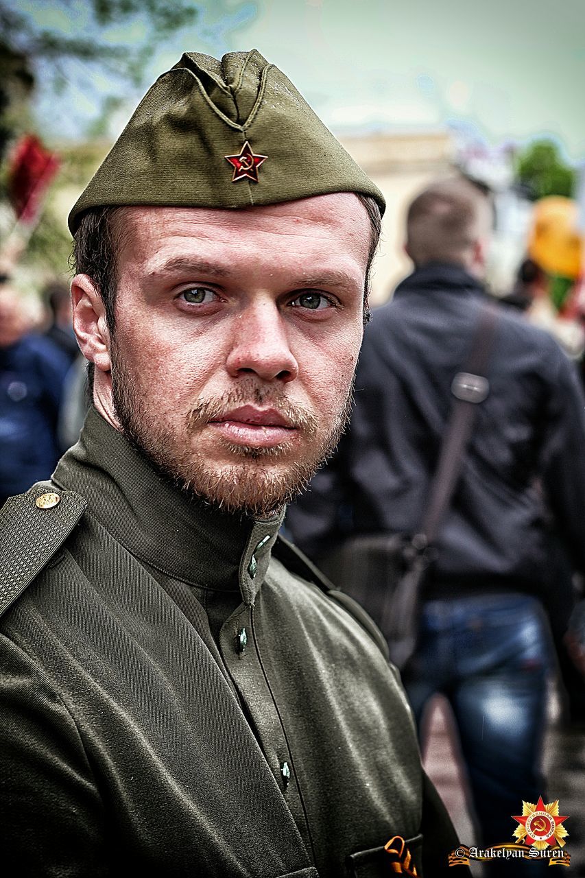 focus on foreground, lifestyles, portrait, headshot, close-up, front view, looking at camera, beard, young men, young adult, leisure activity, human representation, men, person, casual clothing, jacket, human face, mid adult men