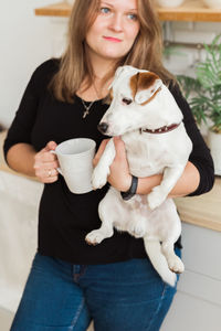 Portrait of woman with dog