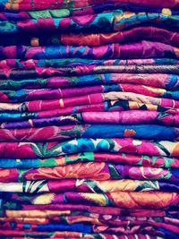 Full frame shot of stacked colorful fabrics in store