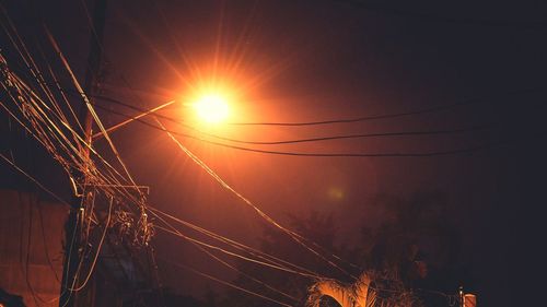 Firework display against sky during sunset