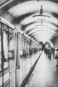 Man in illuminated railroad station