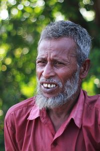 Close-up portrait of man wearing mask outdoors