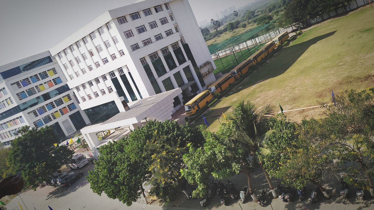 HIGH ANGLE VIEW OF BUILDINGS AND TREES IN CITY