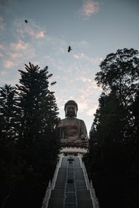 Low angle view of statue against sky