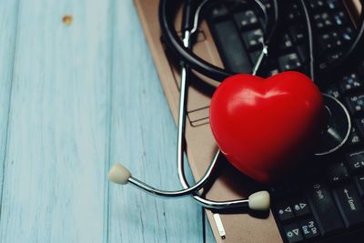 High angle view of red heart shape on table