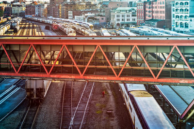 Bridge over river by buildings in city